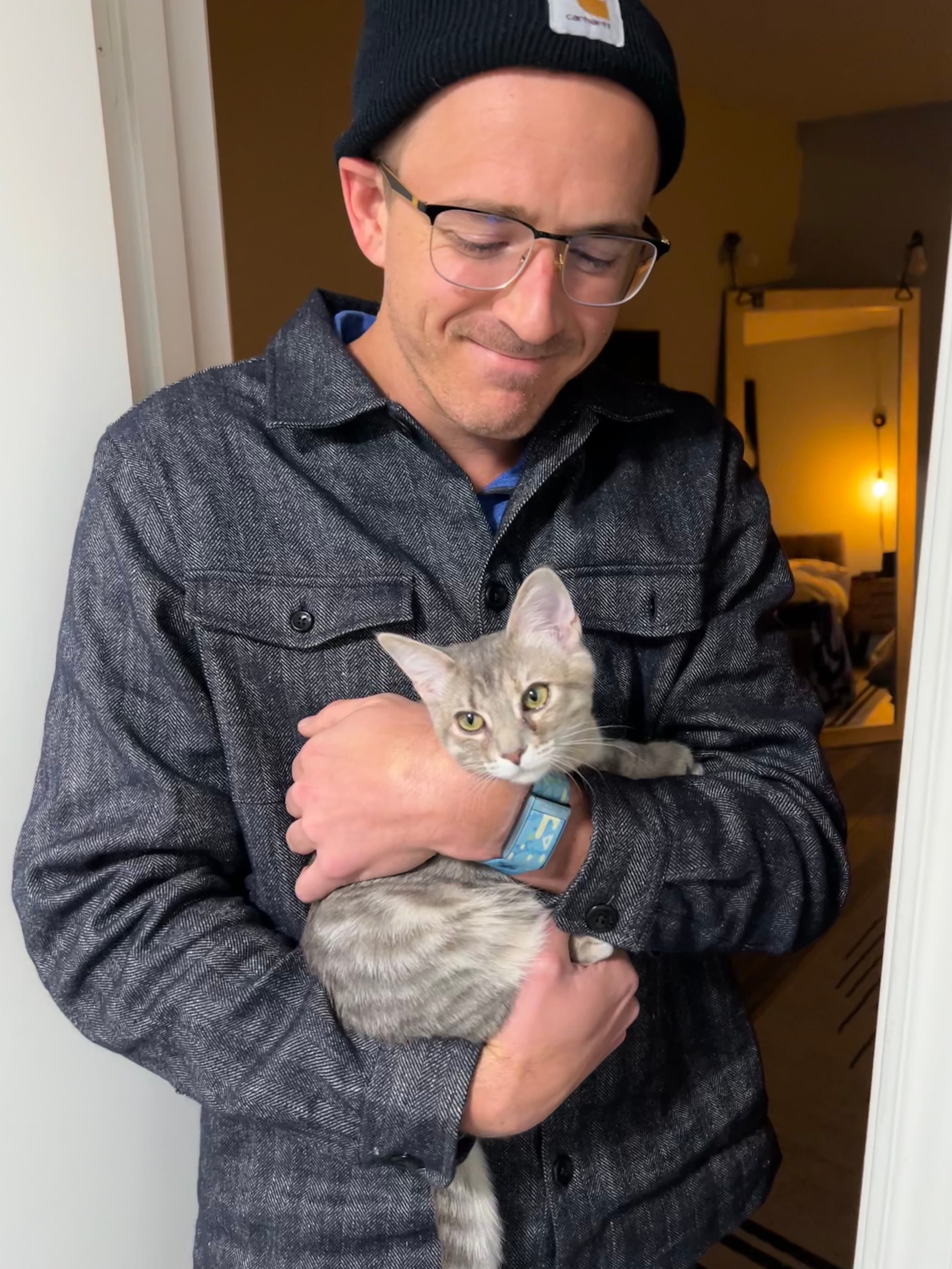 Chase holding their cat